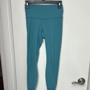 Yogalicious teal colored leggings Size XS, 24” inseam, 1 hidden pocket